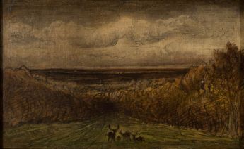 Hirsche auf einem Hügel vor einer Panorama-Landschaft